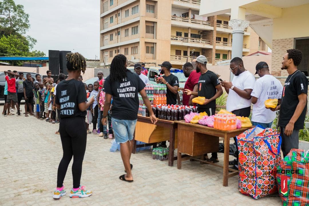 Volunteers handing out food to community members